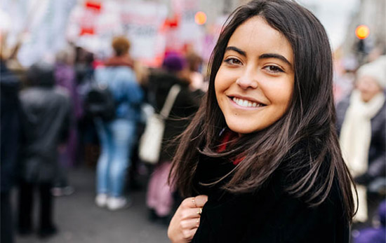 Female student at a meeting outside