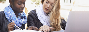 Two students studying for Cambridge English: First